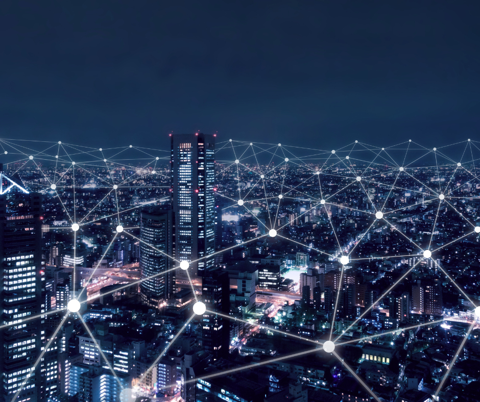 Smart city at night with connected IoT network nodes visualizing real-time urban data connectivity